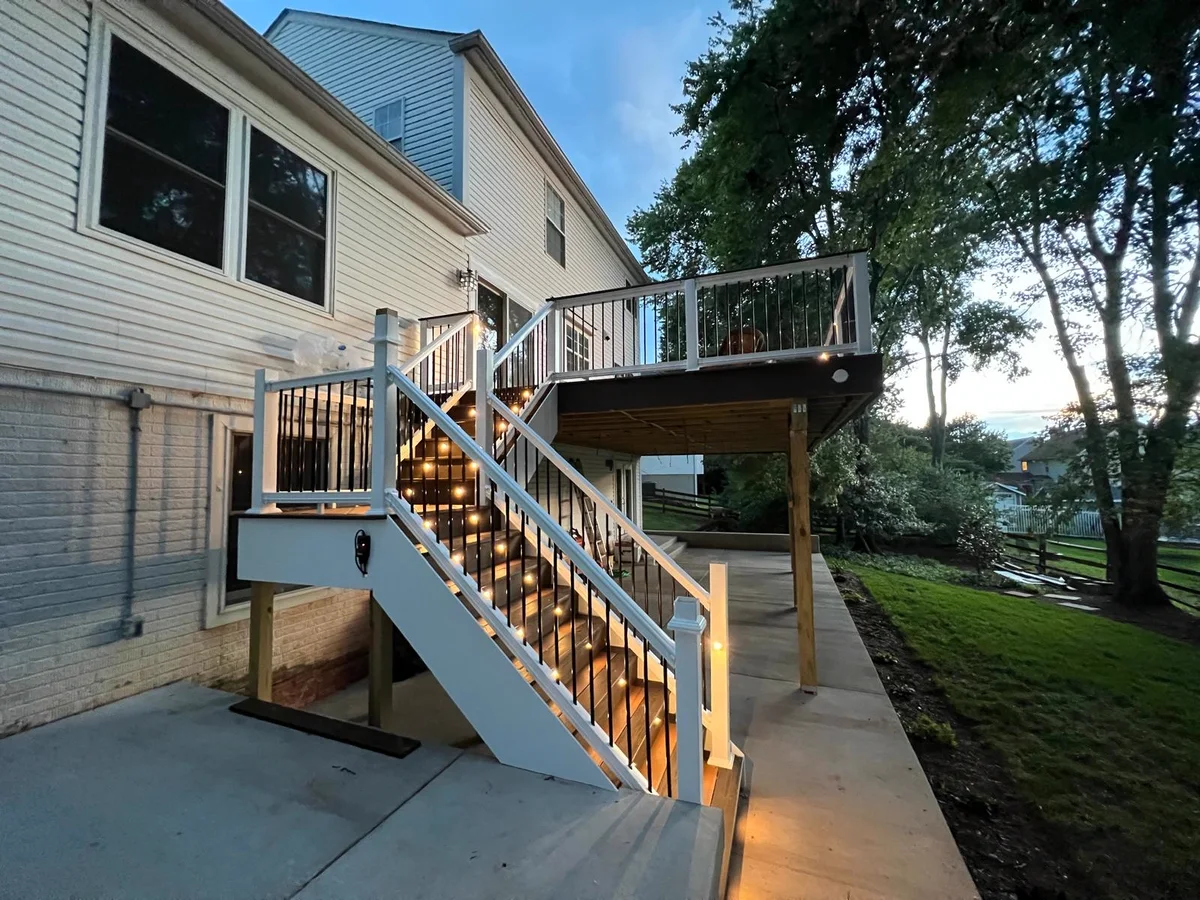Raised deck with lit stairs and railing built to code in Fairfax County, Virginia