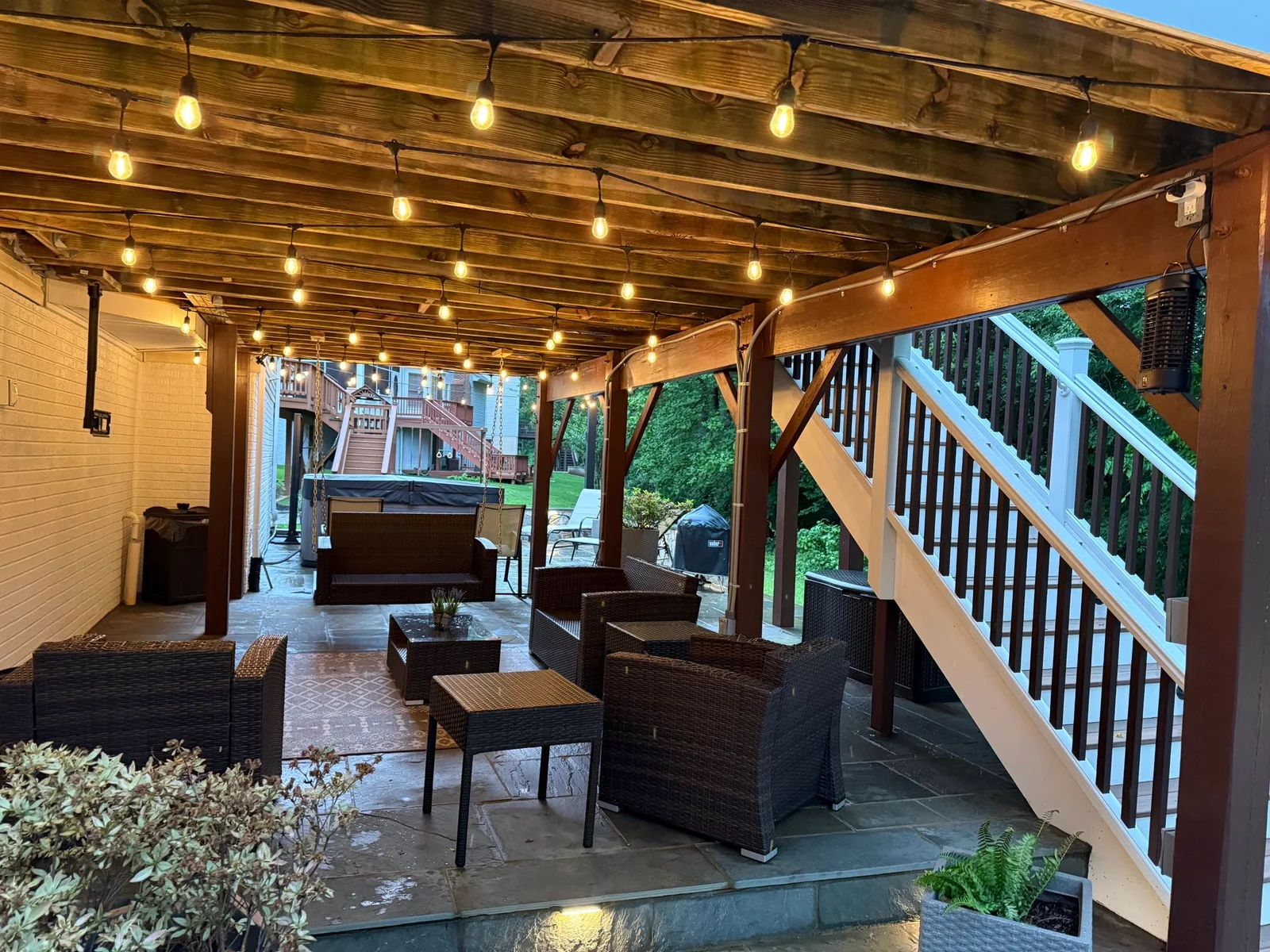 Covered screened porch with pergola and string lighting in Northern Virginia